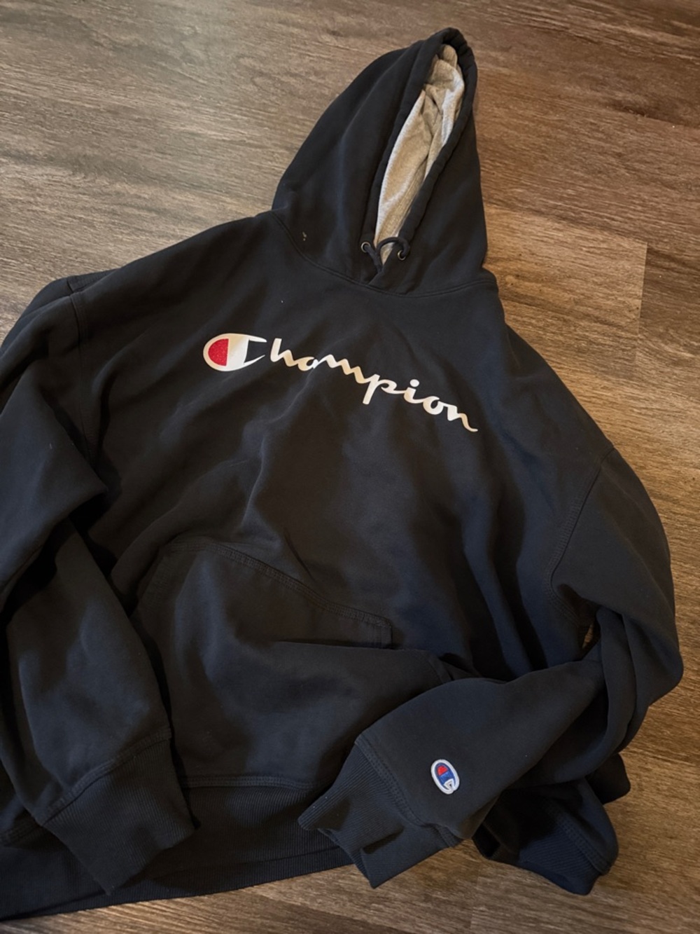 Champion Black Hoodie with White Script and Red Logo Accent